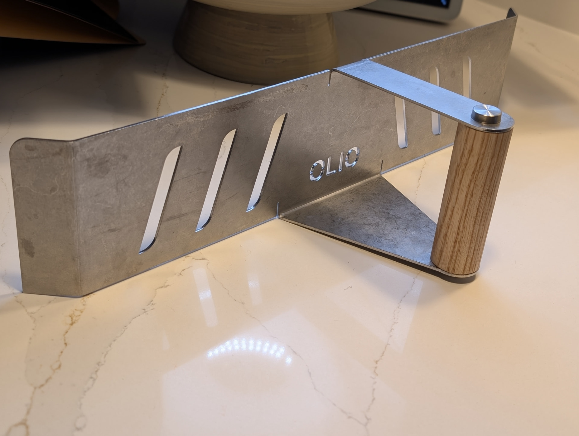 Olio Pizza Box baffle door resting on a kitchen worktop
